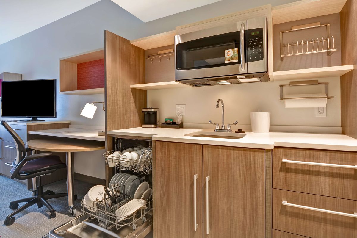 In-suite kitchen with dishwasher and microwave