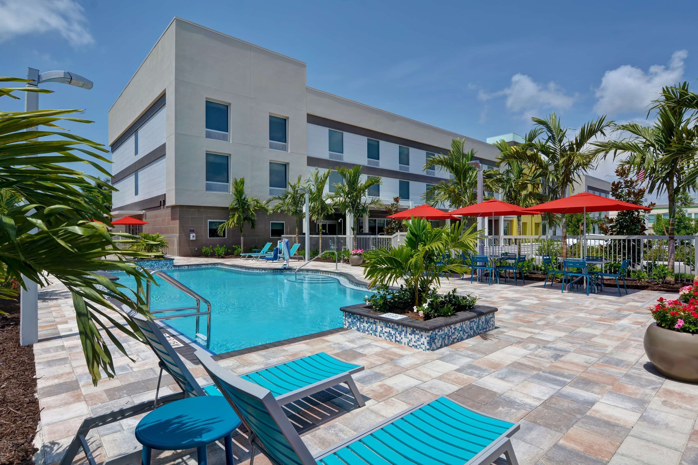 Pool deck with loungers and umbrellas