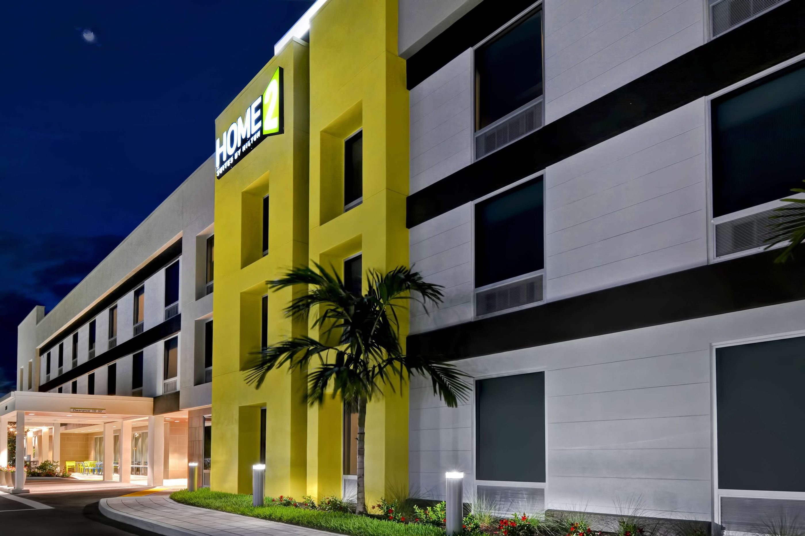 Home2 Suites by Hilton Naples I-75 Pine Ridge Road exterior at twilight