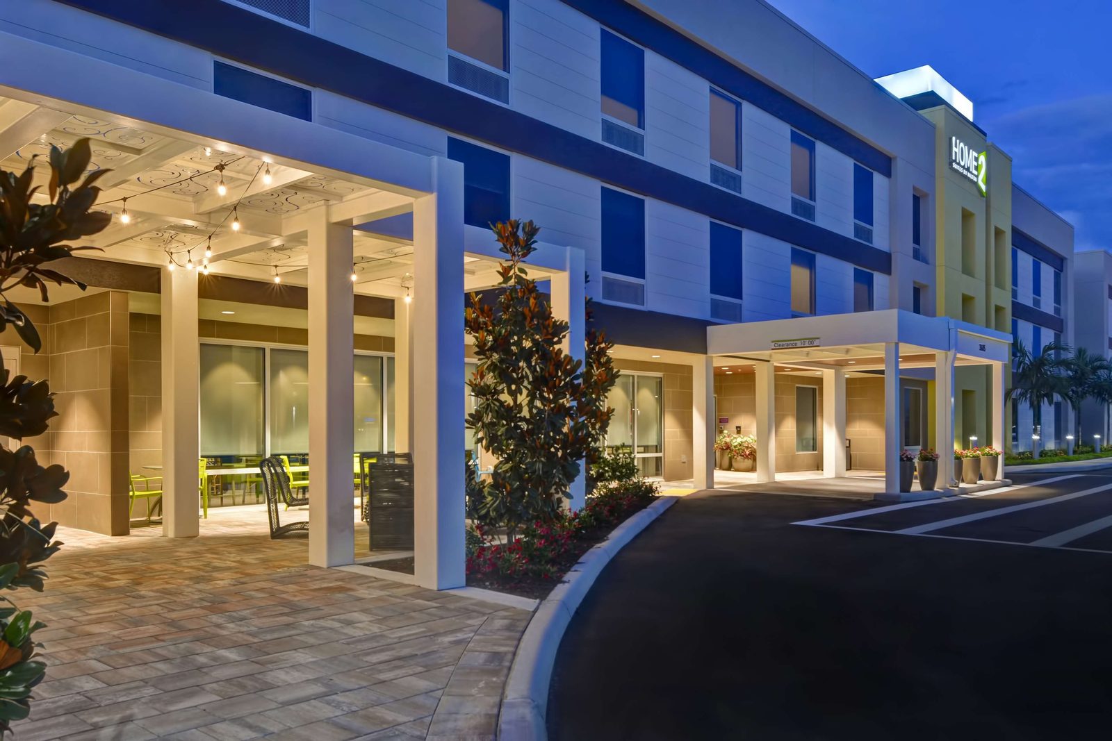 Hotel porte-cochère and entrance at dusk